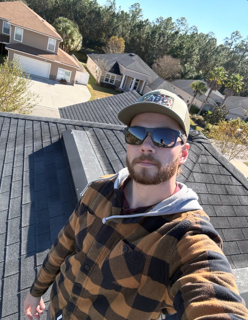 Mark Otterbourg, owner of Otter Roofing, on a roof in Jacksonville, FL
